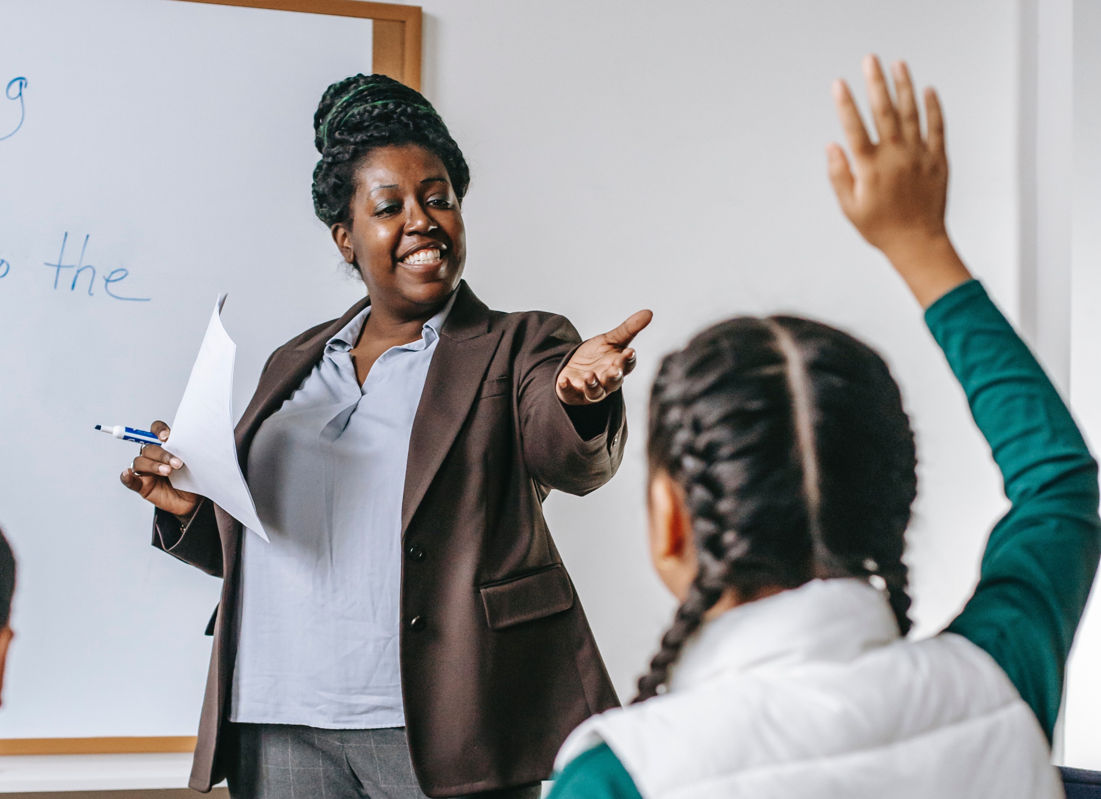 Teacher acknowledging a student in the classroom.