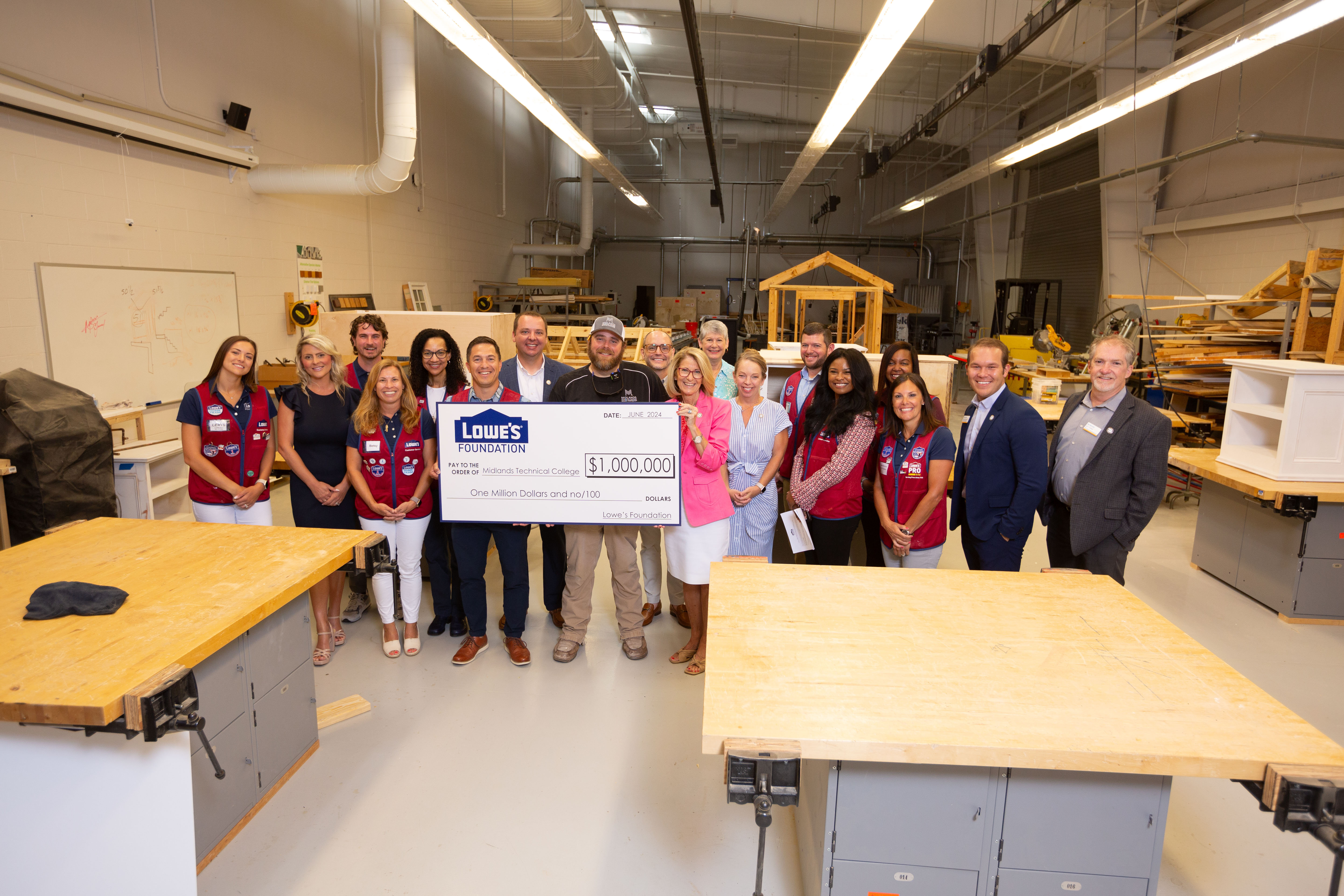 Representatives from the Lowe's Foundation and MTC pose for a group photo with the $1 million Gable Grant check.