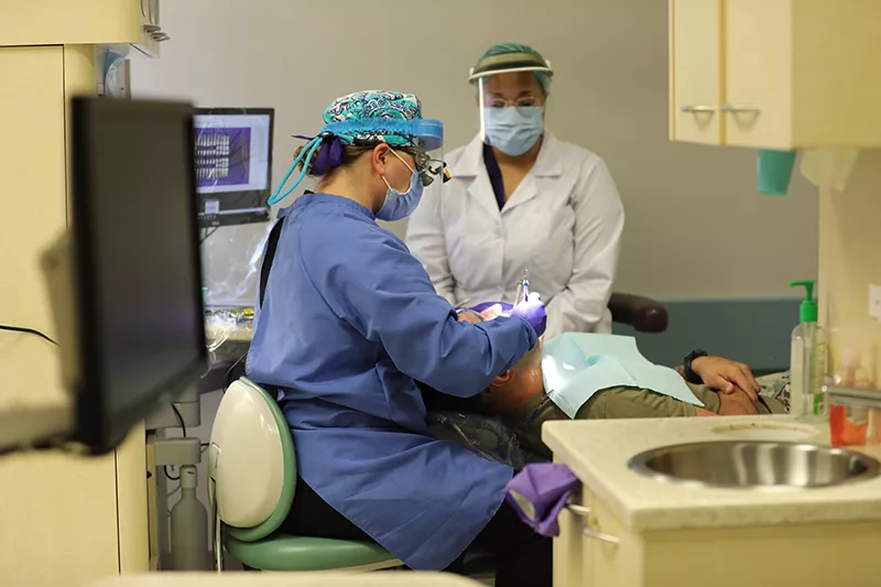 Dental Students working on patient