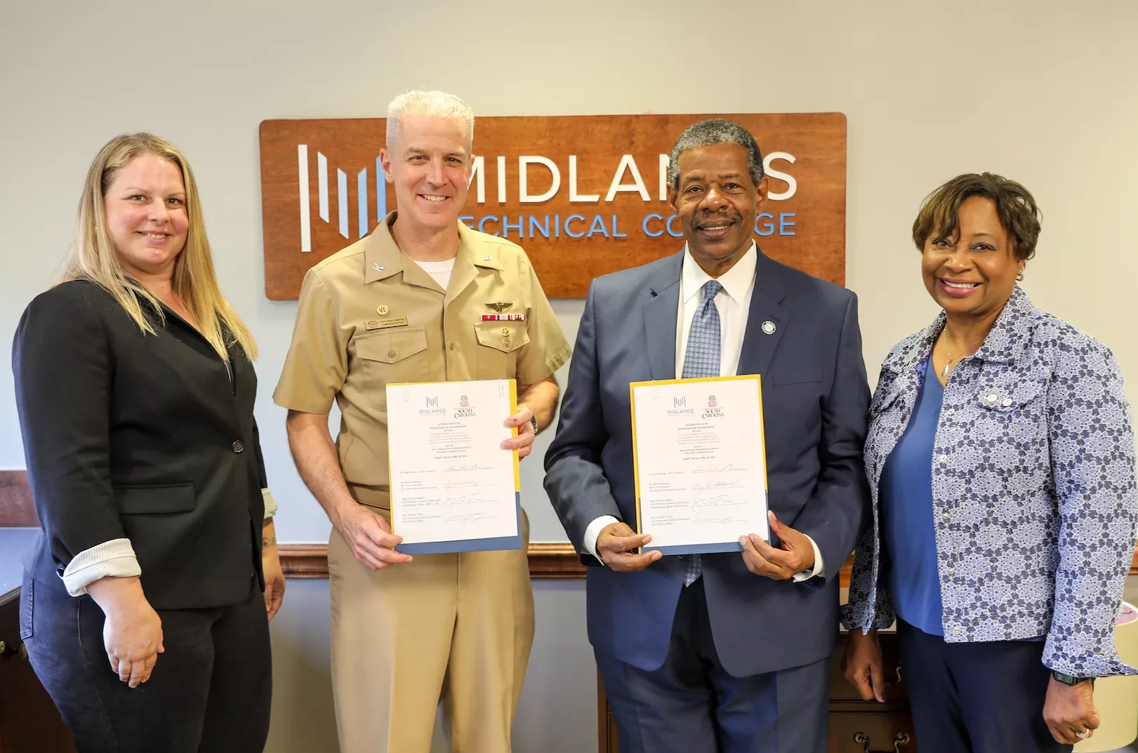 MTC and University of South Carolina ROTC leaders pose for a photo following a ceremonial Navy ROTC signing.