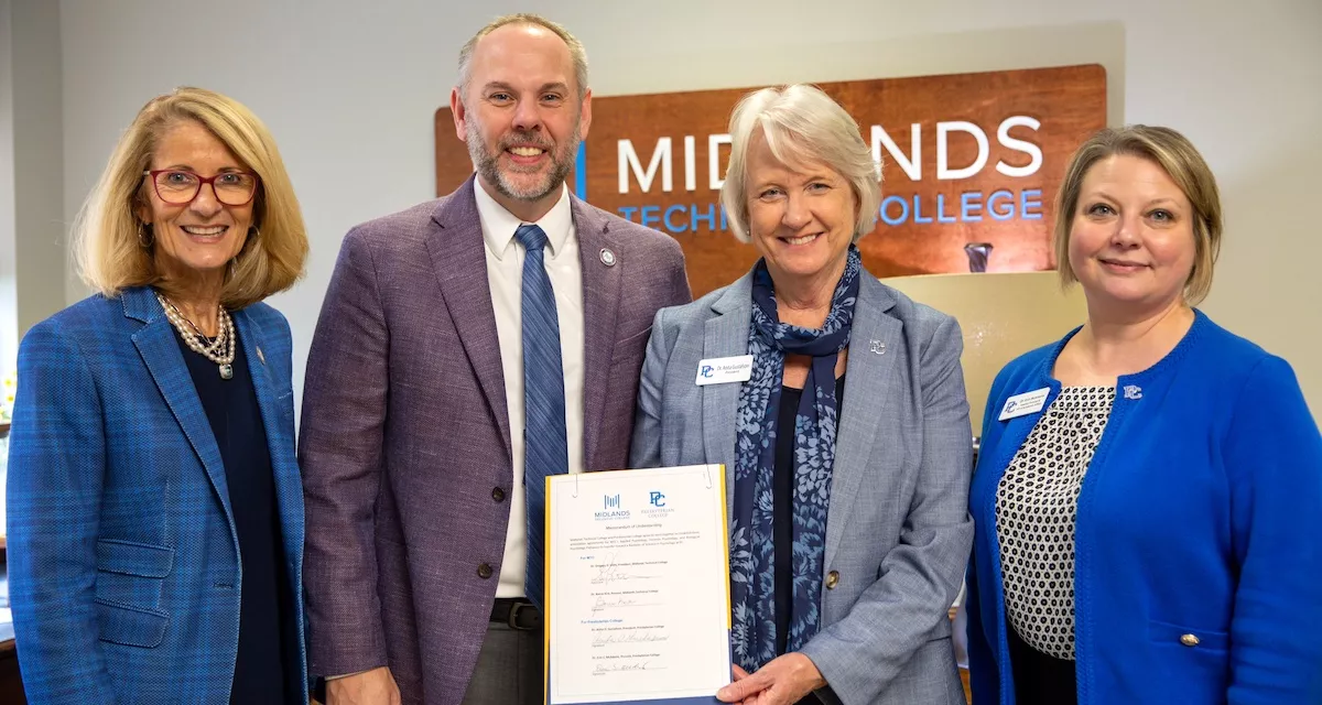 College officials from Presbyterian College and Midlands Technical College gathered on Sept. 25 for a signing ceremony to seal a transfer agreement.