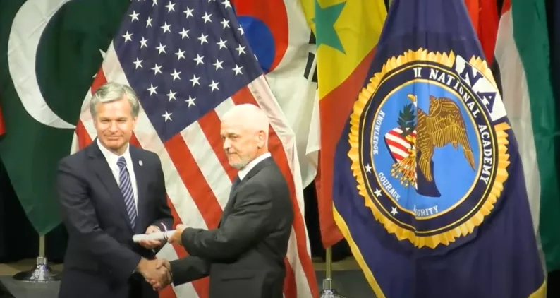 Image of MTC Chief of Police, Tim Martin, being recognized from the FBI National Academy.